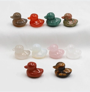 Detailed set of ten hand-carved natural crystal duck figurines in various gemstones