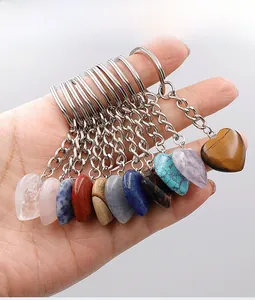 Selection of heart-shaped natural crystal keychains in various colorful gemstones