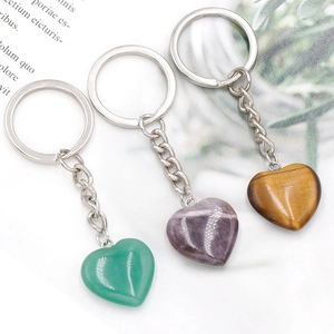 Three natural crystal heart keychains in green aventurine, amethyst, and tiger eye stone