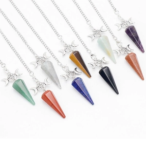 Various healing crystal hexagonal pendants with silver triple moon and star charms