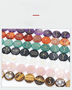 Macro detail of various natural crystal rune stones with engraved gold mystic symbols