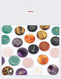 Macro view of natural stone runes with gold engraved mystic symbols for spiritual healing