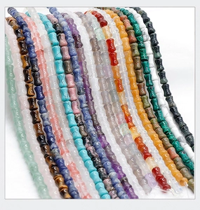 Polished bamboo-shaped natural crystal and agate beads in various colorful gemstones