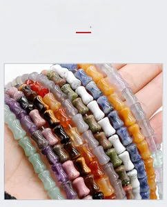 Detailed close-up of bamboo-shaped colorful natural crystal beads for DIY jewelry making