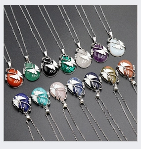 Detailed collection of crystal butterfly pendants in various natural stones and colors