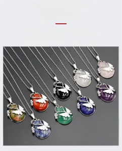 Detailed view of handmade butterfly wire wrapped natural crystal stone necklaces set