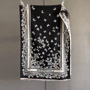 Detail of French retro scarf showing elegant butterfly jacquard patterns and soft fabric