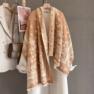 Macro detail of French vintage butterfly jacquard scarf with elegant fringe trim
