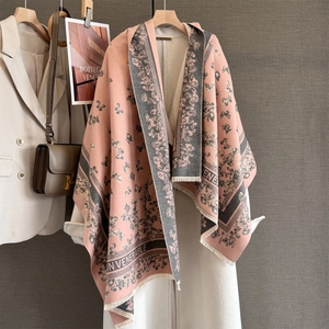 Detail of soft pink and grey butterfly jacquard scarf with fine fringe edges