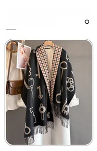 Detailed texture of dual-sided imitation cashmere scarf with vintage key patterns and fringe