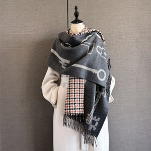 Detail of cashmere-like scarf showing double-sided vintage key pattern and houndstooth weave