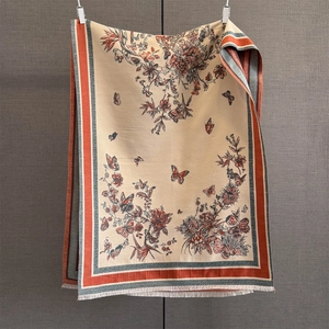 Detail of vintage cashmere-like butterfly print scarf with elegant tassel fringe edges