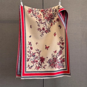 Detail of vintage cashmere-like shawl featuring floral butterfly patterns and fine tassels