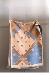 Detail of elegant jacquard scarf with retro belt patterns and soft fringe edges