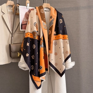 Detail of jacquard scarf with retro belt patterns and soft fringe in autumn colors