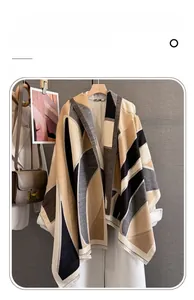 Detail of thickened imitation cashmere scarf featuring geometric patterns and fringe edges