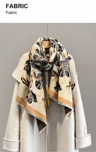 Close-up of imitation cashmere scarf featuring floral jacquard and delicate fringe trim