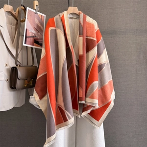 Thick geometric color-block shawl scarf with fringe in orange and brown tones