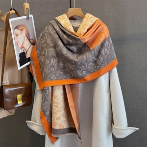 Autumn paisley print color-block shawl with fringe, styled on a white wool coat