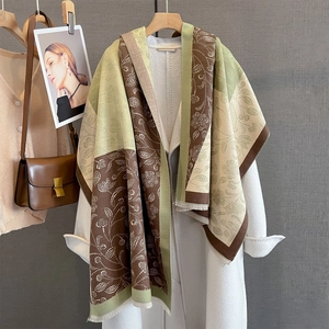 Retro paisley patchwork shawl with earthy green and brown tones and elegant fringes