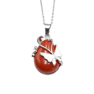Vintage necklace featuring a red natural stone pendant with a white butterfly ornament