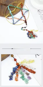 Detail view of handmade chakra stone star dream catcher with colorful crystal tassels