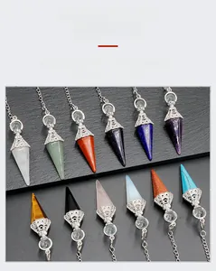 Macro detail of natural hexagonal crystal pendants with vintage silver filigree caps