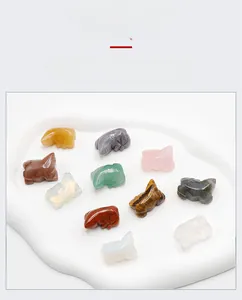 Detailed macro view of assorted natural crystal lizard carvings in various mineral stones