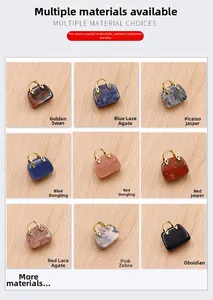 Macro view of nine different natural crystal mini handbag charms with gold handles
