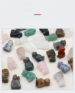 Detailed view of hand-carved natural crystal animal figurines in various gemstones