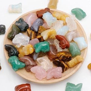Mix of small carved crystal animal figurines in natural agate and quartz stones