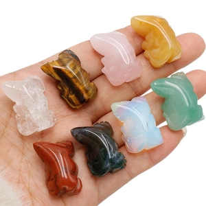 Set of eight assorted natural crystal and agate lizard figurines held in hand