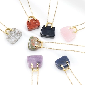 Miniature handbag pendants crafted from various natural crystal stones with gold chains