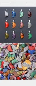 Collection of twelve different natural gemstone crescent moon pendants with silver bails