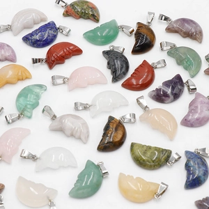 Carved crescent moon face pendants made of natural healing crystal and polished gemstones