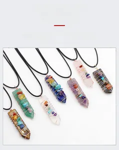 Macro view of natural crystal arrow pendants with wire wrapping and braided cord necklace