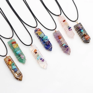 Set of 7 wire wrapped natural crystal arrow pendants with chakra stones and wax cord