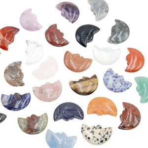 Double-sided moon face carvings in diverse natural crystals and polished gemstones