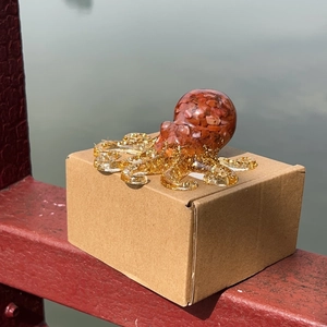 Octopus figurine with red agate stones and golden glitter resin for home desk decoration