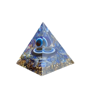 Lapis lazuli and evil eye energy orgone pyramid with gold foil for home decoration