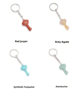 Detailed view of heart-shaped keychains in Red Jasper, Grey Agate, and Turquoise stone
