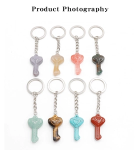 Detailed view of 8-piece natural crystal heart-shaped keychains in various gemstones
