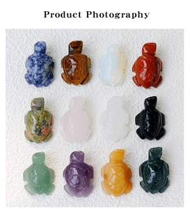 Detailed grid view of twelve hand-carved crystal turtle figurines in various natural gemstones