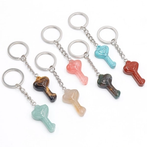 Natural heart crystal keychains in various gemstones like tiger eye and rose quartz stones