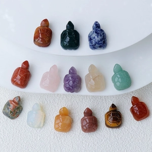 Detailed group shot of hand-carved natural crystal turtles in various gemstones and minerals