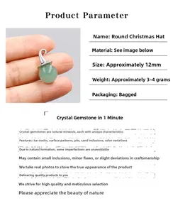 Detail view of a 12mm round green crystal pendant with silver Christmas hat cap