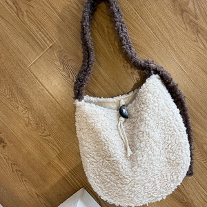 Creamy plush lamb wool tote bag with dark coffee shoulder strap and horn buckle