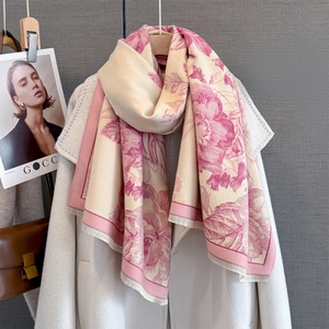 Pink and beige cashmere-style scarf with floral jacquard and fringe on white wool coat