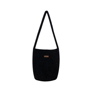 Sparkly black plush bucket bag with fuzzy knit texture and long shoulder strap