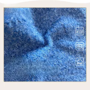 Macro texture of soft blue plush fabric showing high-density fluffy faux fur fibers